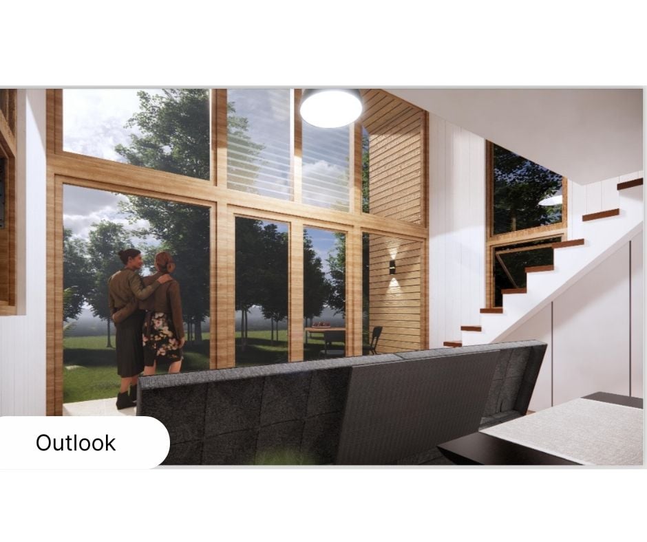 View from inside a customised cabin's lounge, featuring large, arch-peaked windows overlooking a scenic landscape.